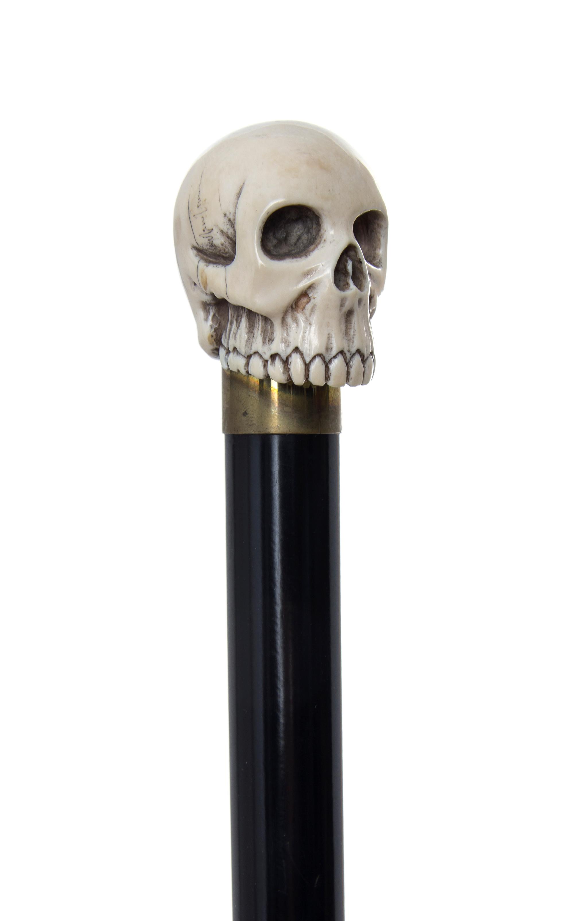 An American Ivory Handled Walking Stick, Diameter of handle 1 3/8 x length overall 34 3/4 inches.