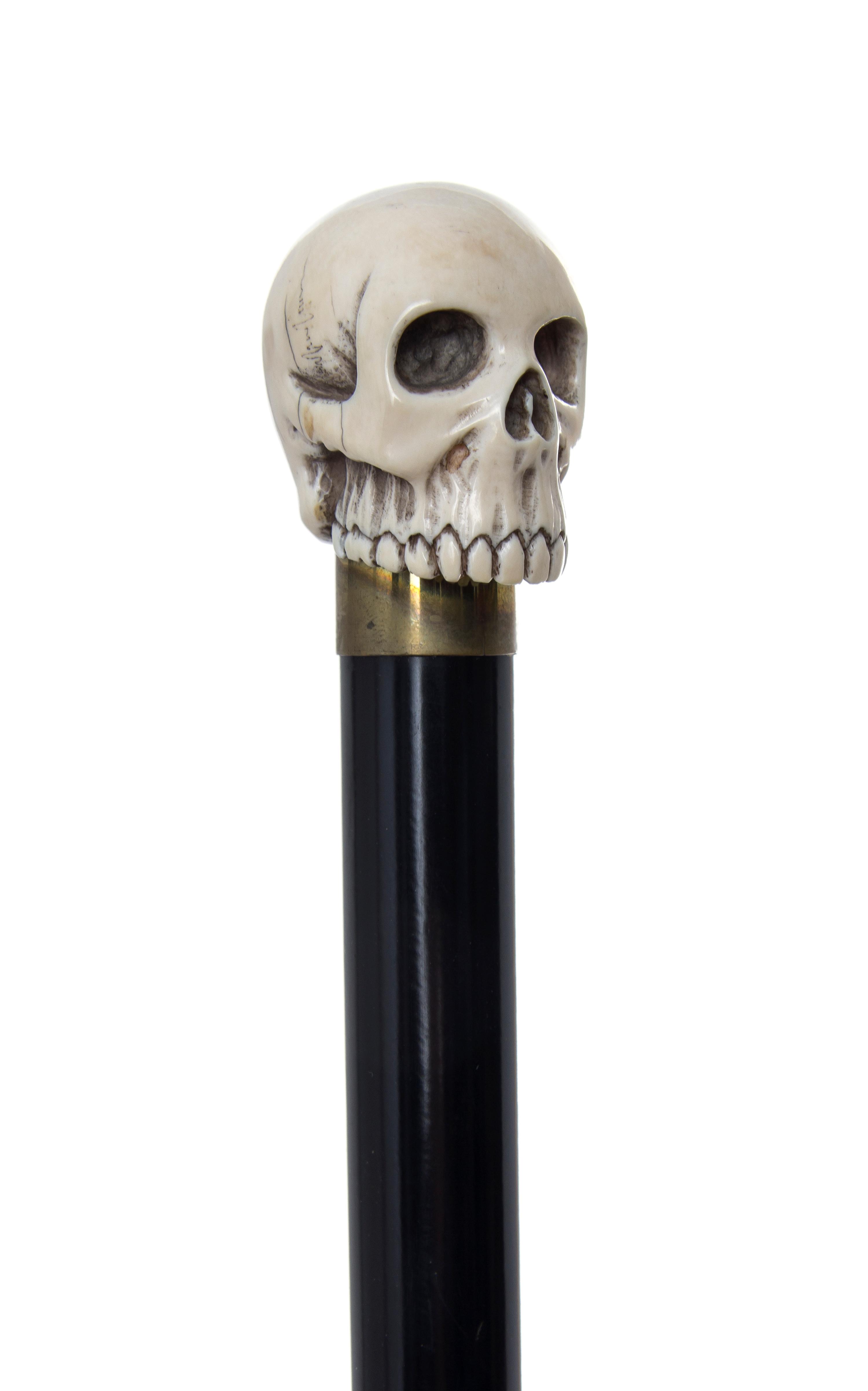 An American Ivory Handled Walking Stick, Diameter of handle 1 3/8 x length overall 34 3/4 inches.