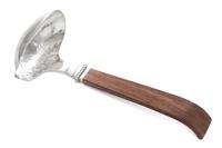 A Mexican Sauce Ladle, William Spratling, Taxco, 1940, having a spot hammered bowl with a beaded join to the flat wood handle.