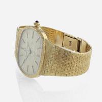 A 14K yellow gold wristwatch, Universal