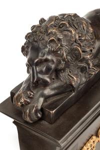 A Pair of Directoire Style Parcel Gilt Bronze Lion Ornaments