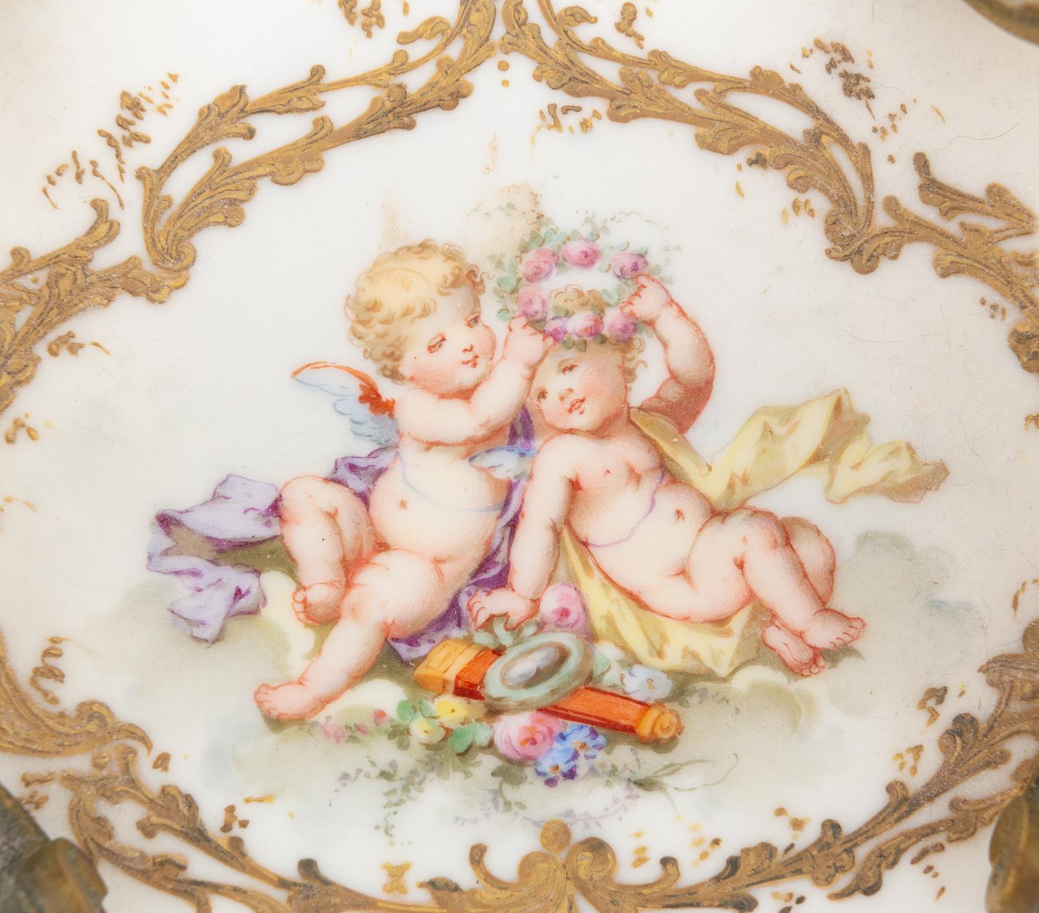 A Continental Enameled Porcelain and Gilt Metal Inkwell and Stand