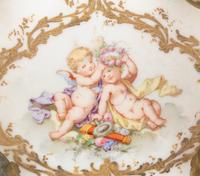 A Continental Enameled Porcelain and Gilt Metal Inkwell and Stand