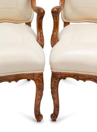 A Set of Four Régence Style Leather-Upholstered Armchairs