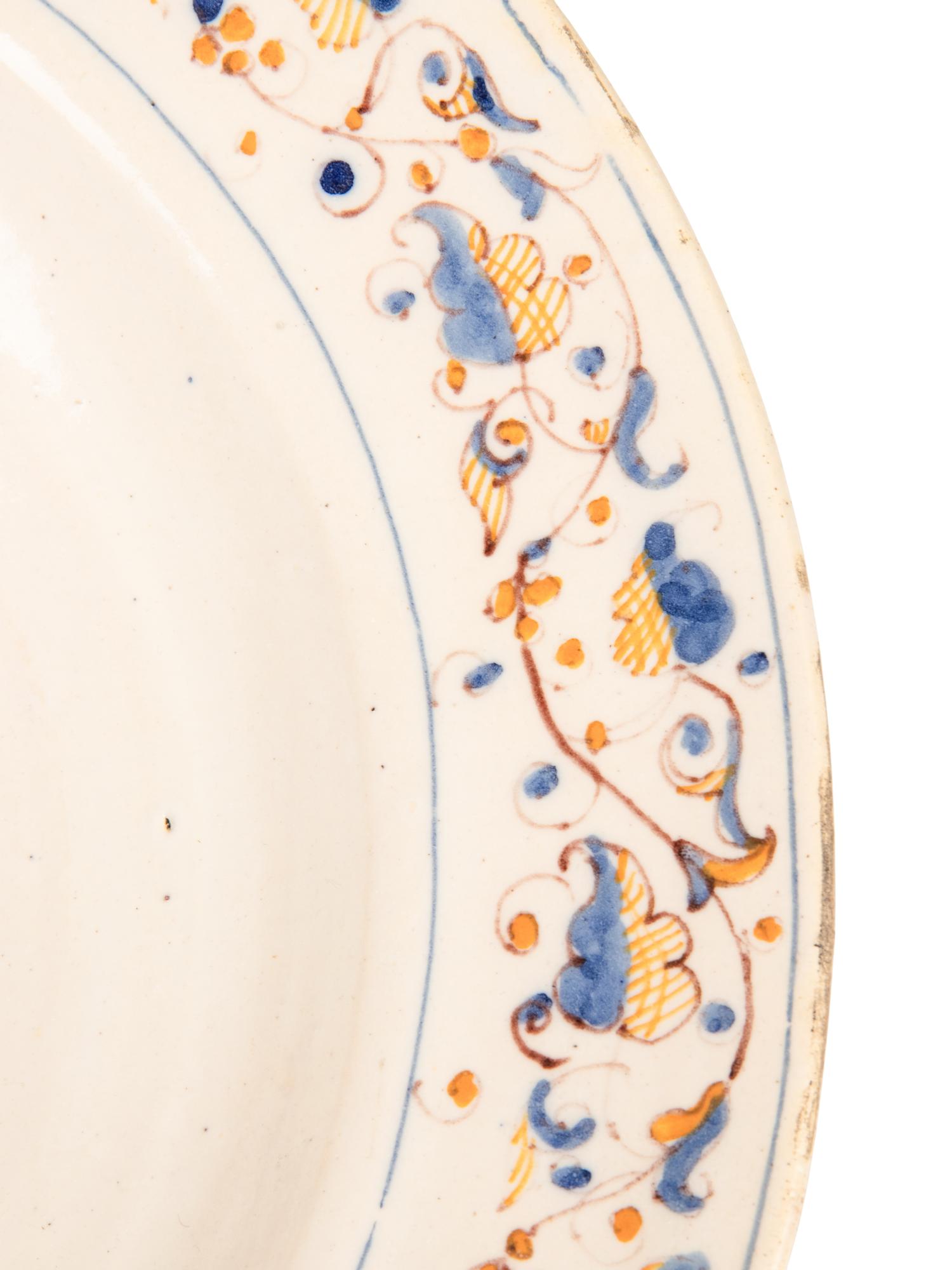 A Dutch Glazed Earthenware Armorial Charger