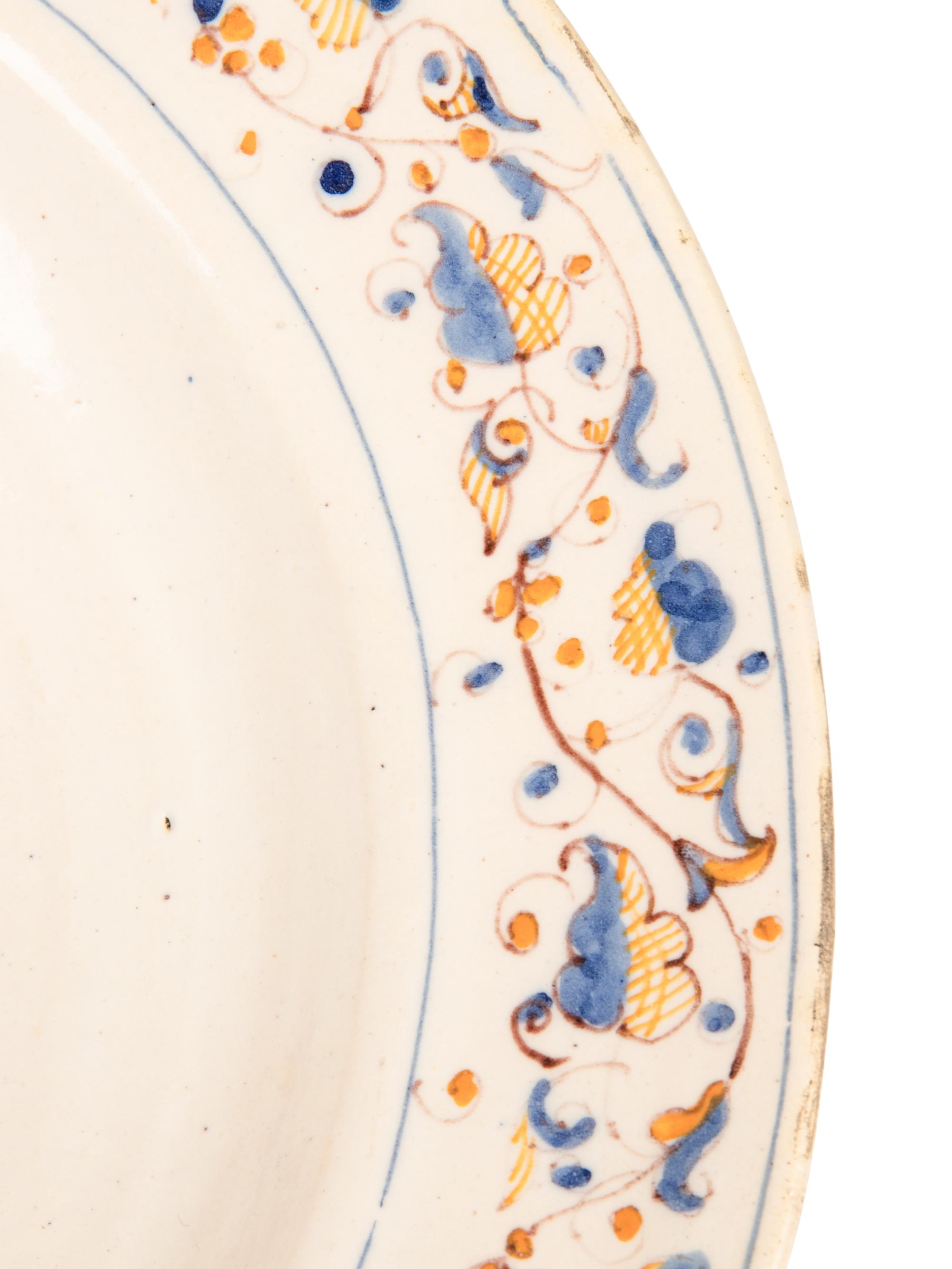 A Dutch Glazed Earthenware Armorial Charger