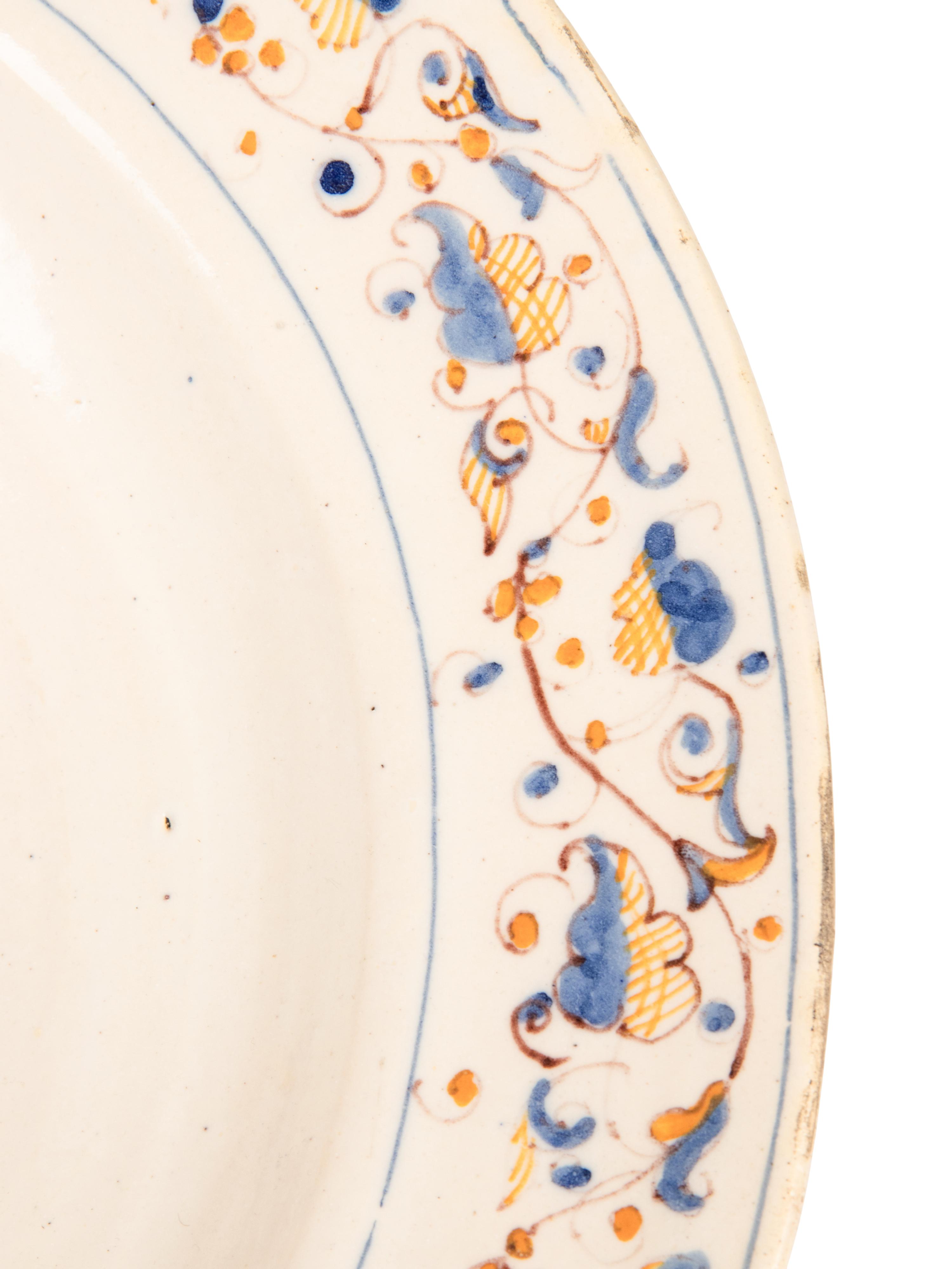 A Dutch Glazed Earthenware Armorial Charger