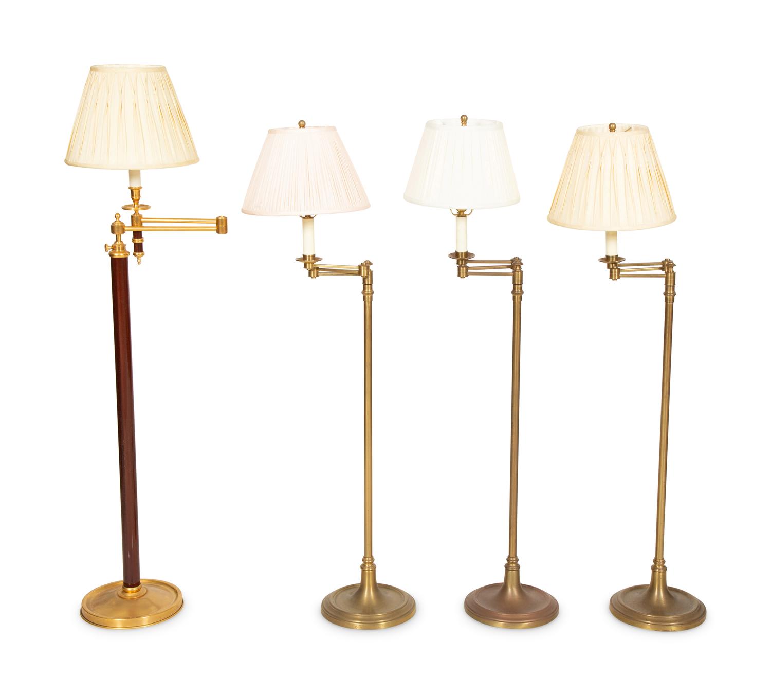 A Group of Four Brass Adjustable Floor Lamps
