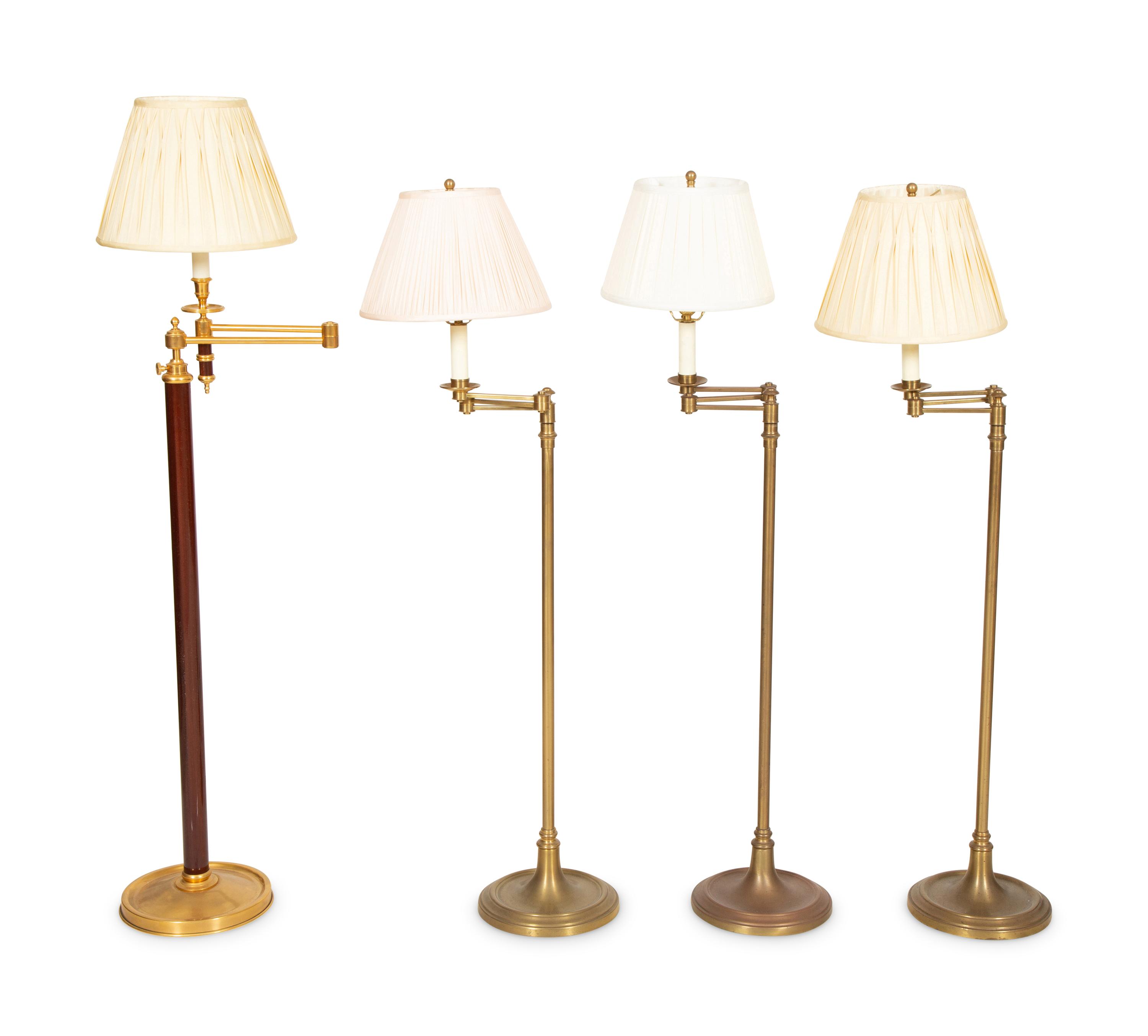 A Group of Four Brass Adjustable Floor Lamps