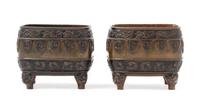 A Pair of Bronze Censers Height 3 1/2 inches.