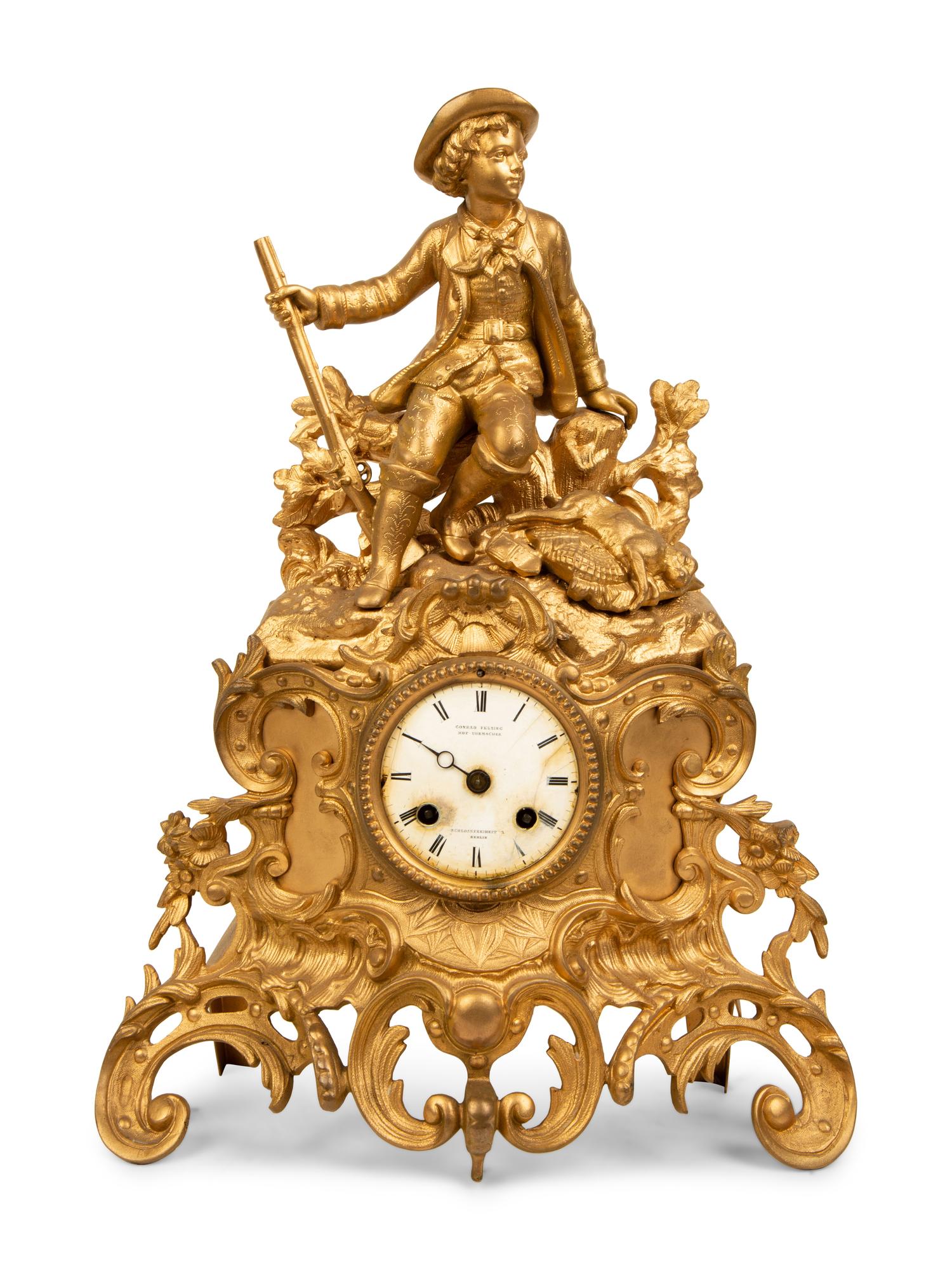 A French Gilt Metal Figural Clock — LATE 19TH CENTURY