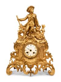 A French Gilt Metal Figural Clock — LATE 19TH CENTURY