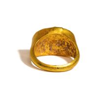 A Roman Glass and Gold Finger Ring with Two Athletes