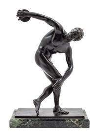 A German Bronze Figure of a Discus Thrower Height overall 14 1/2 inches. — AFTER THE ANTIQUE, CAST BY AKTIEN GESELLSCHAFT GLADENBECK, BERLIN