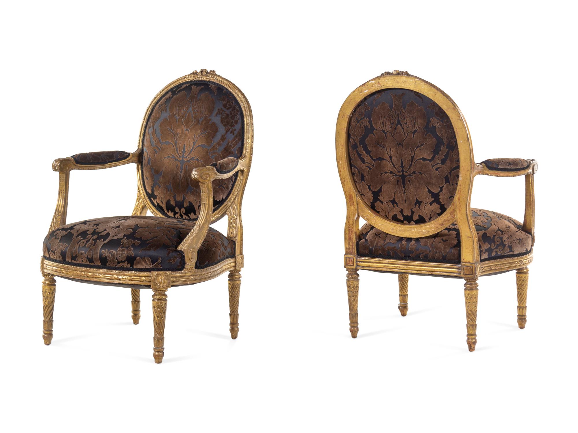A Pair of Louis XVI Giltwood Fauteuils
