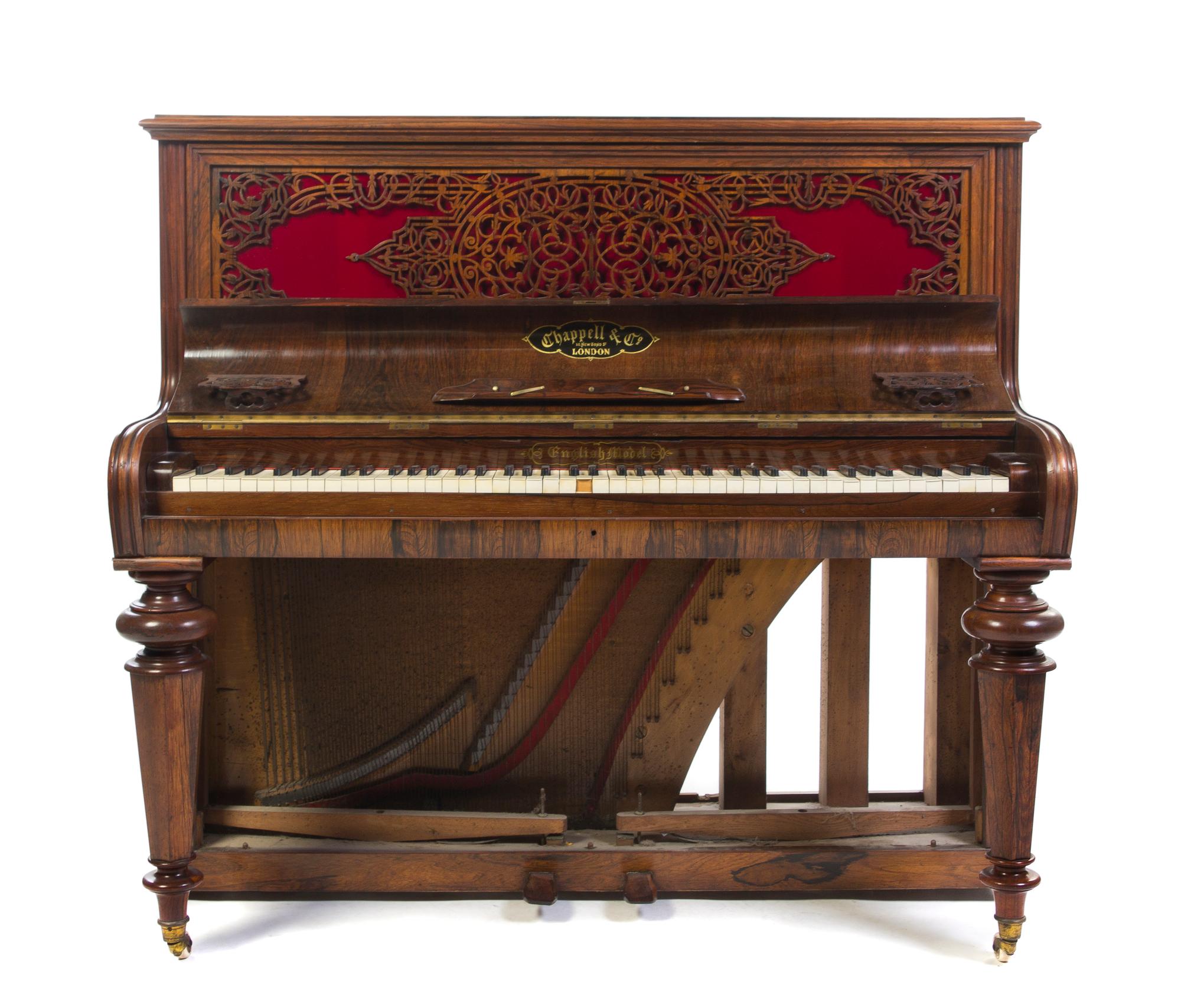 A Victorian Upright Rosewood Piano, Chappell & Co., Height 49 x width 53 1/4 x depth 26 inches.