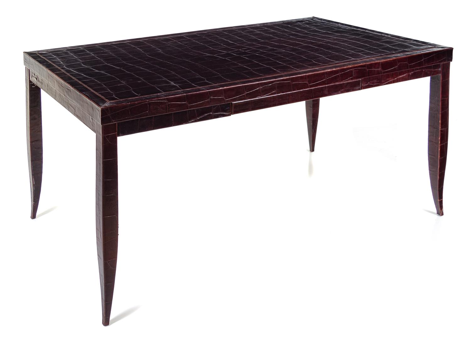 An Art Deco Style Embossed Leather-Veneered Writing Table Height 30 1/2 x width 53 x depth 33 inches. — 20TH CENTURY