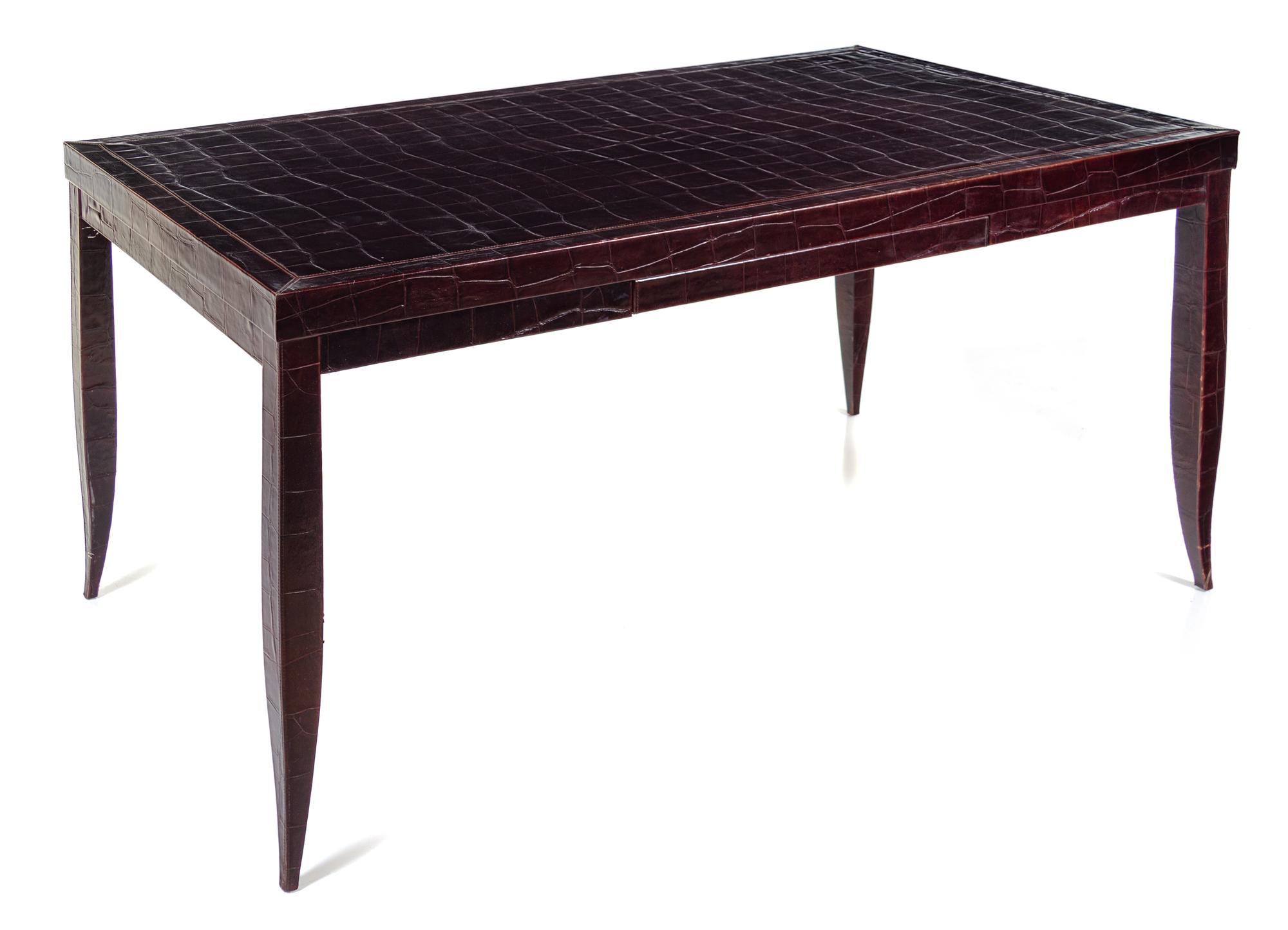 An Art Deco Style Embossed Leather-Veneered Writing Table Height 30 1/2 x width 53 x depth 33 inches. — 20TH CENTURY