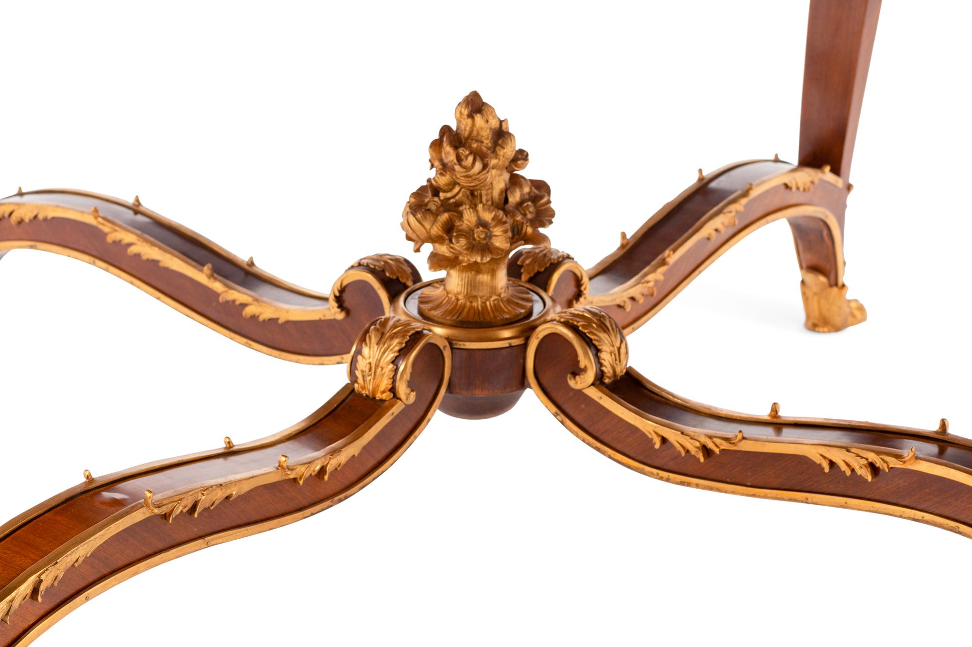 A Louis XV Style Gilt Bronze Mounted Marble-Top Center Table