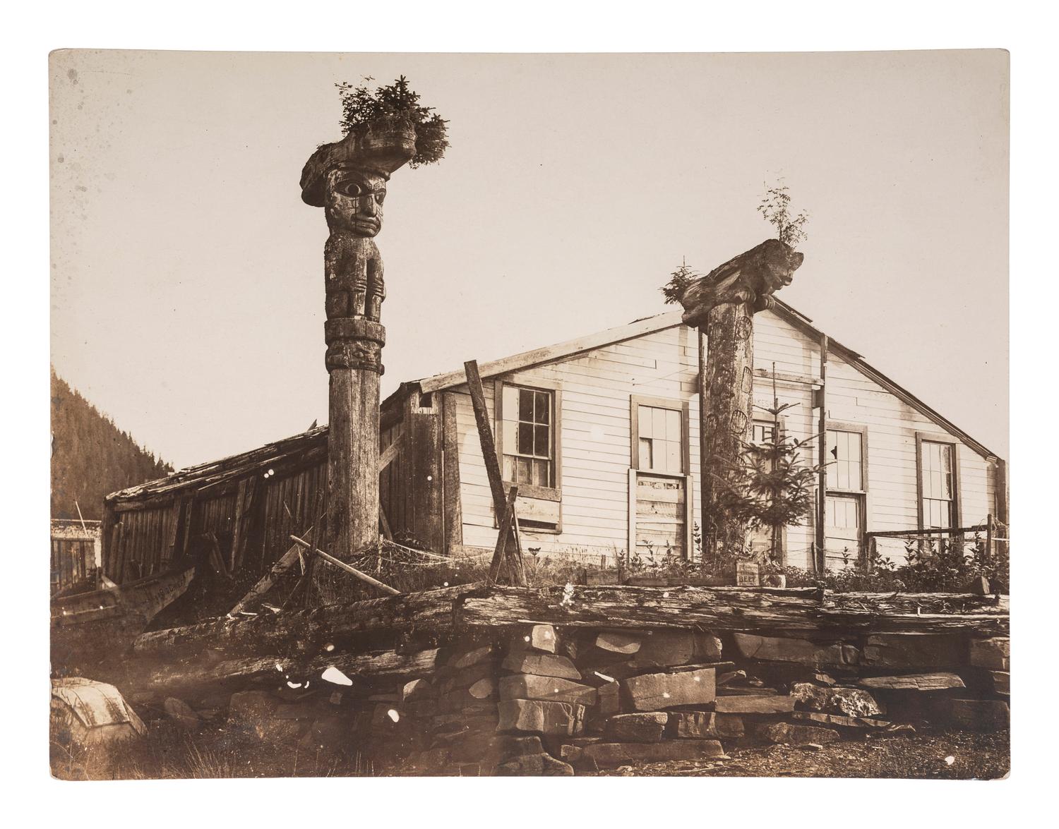 [NATIVE AMERICANS]. STODDARD, Seneca Ray (1844-1917), photographer. A group of 2 photographs of Tlingit Chief Shakes totem poles and home, Fort Wrangell, Alaska.