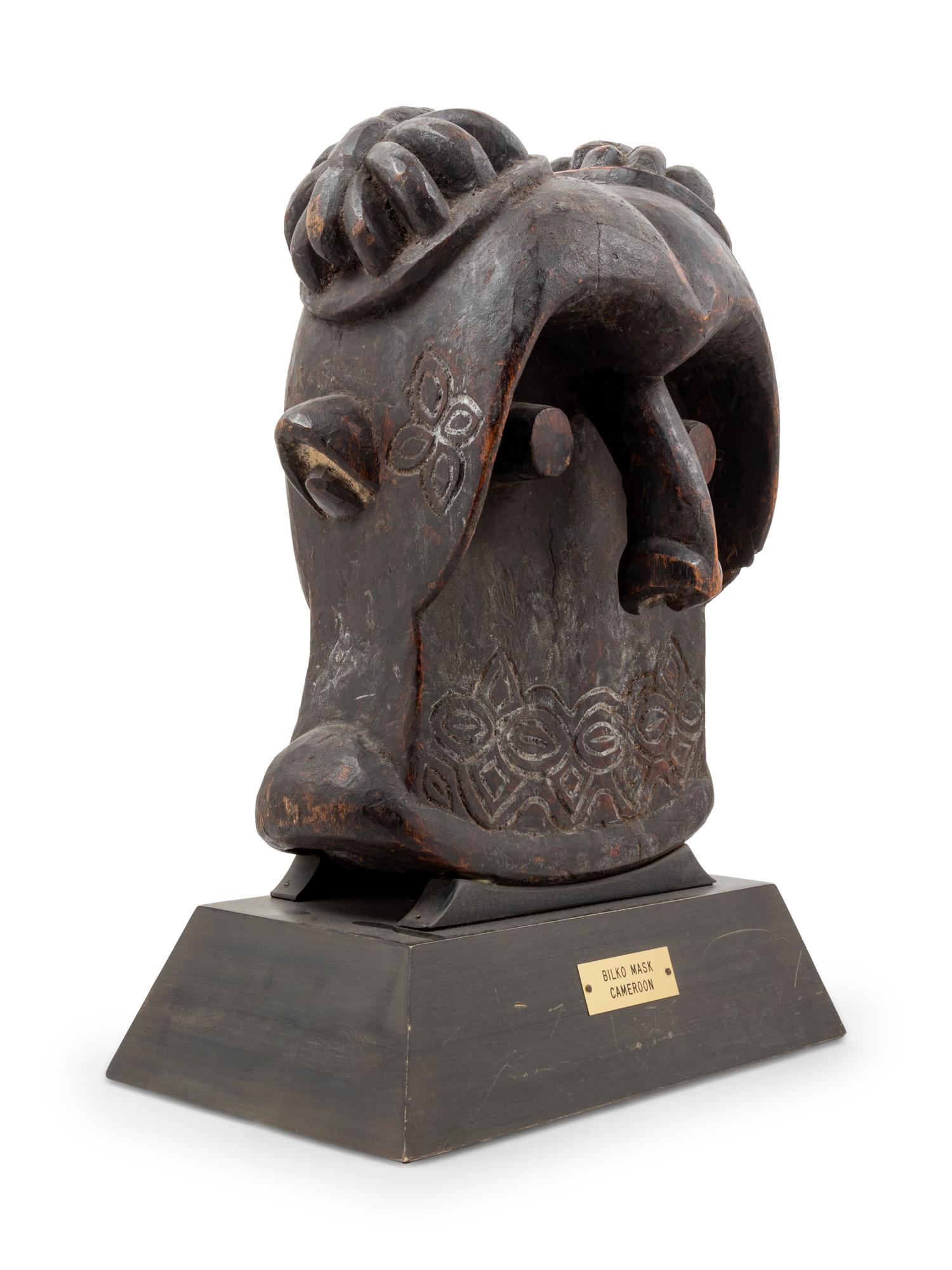 A Bamileke Carved Wood Helmet Mask