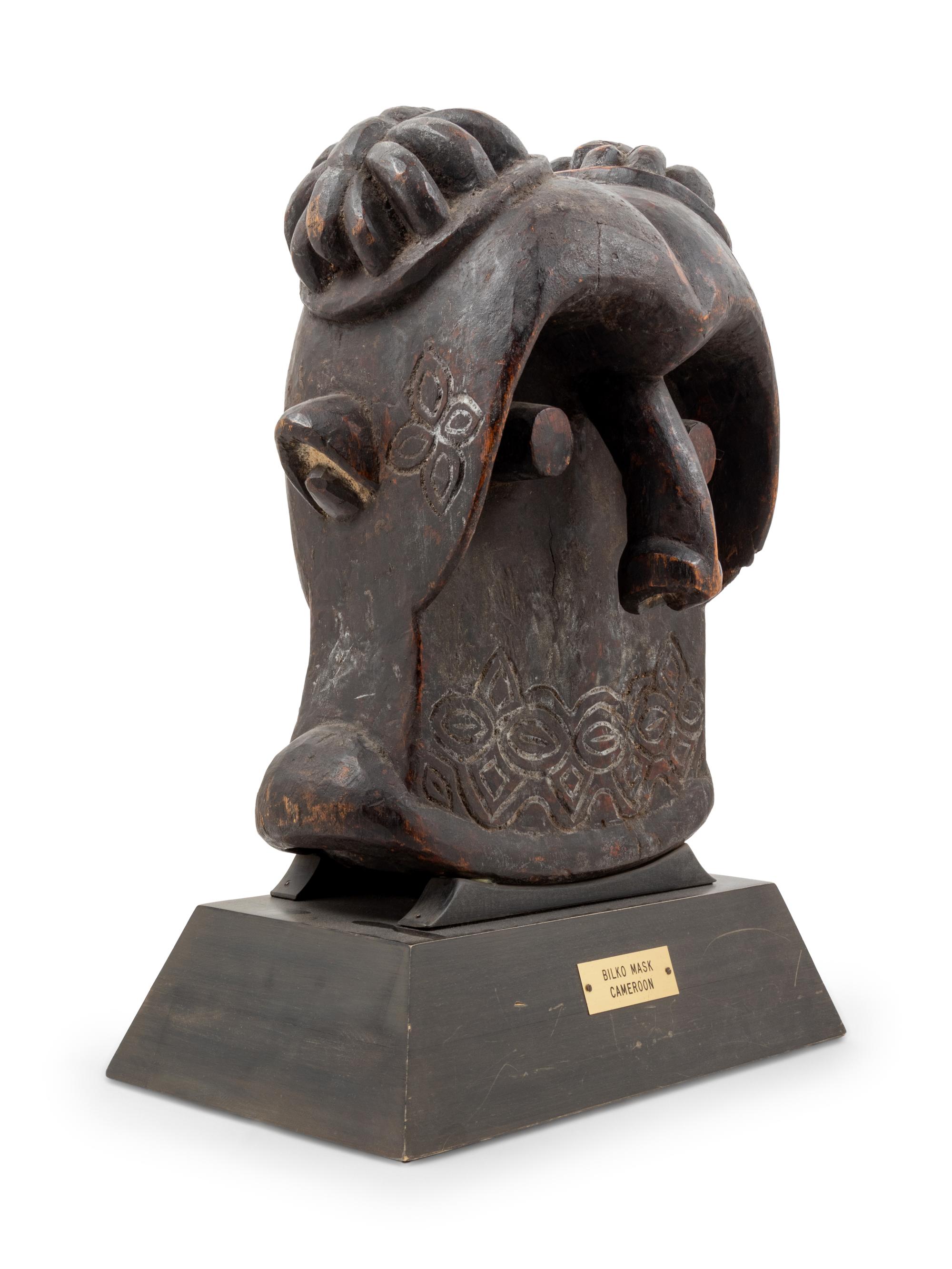 A Bamileke Carved Wood Helmet Mask