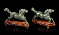 A Pair of Spinach Jade Figures of Horses Length of each 8 1/4 inches. — 20TH CENTURY
