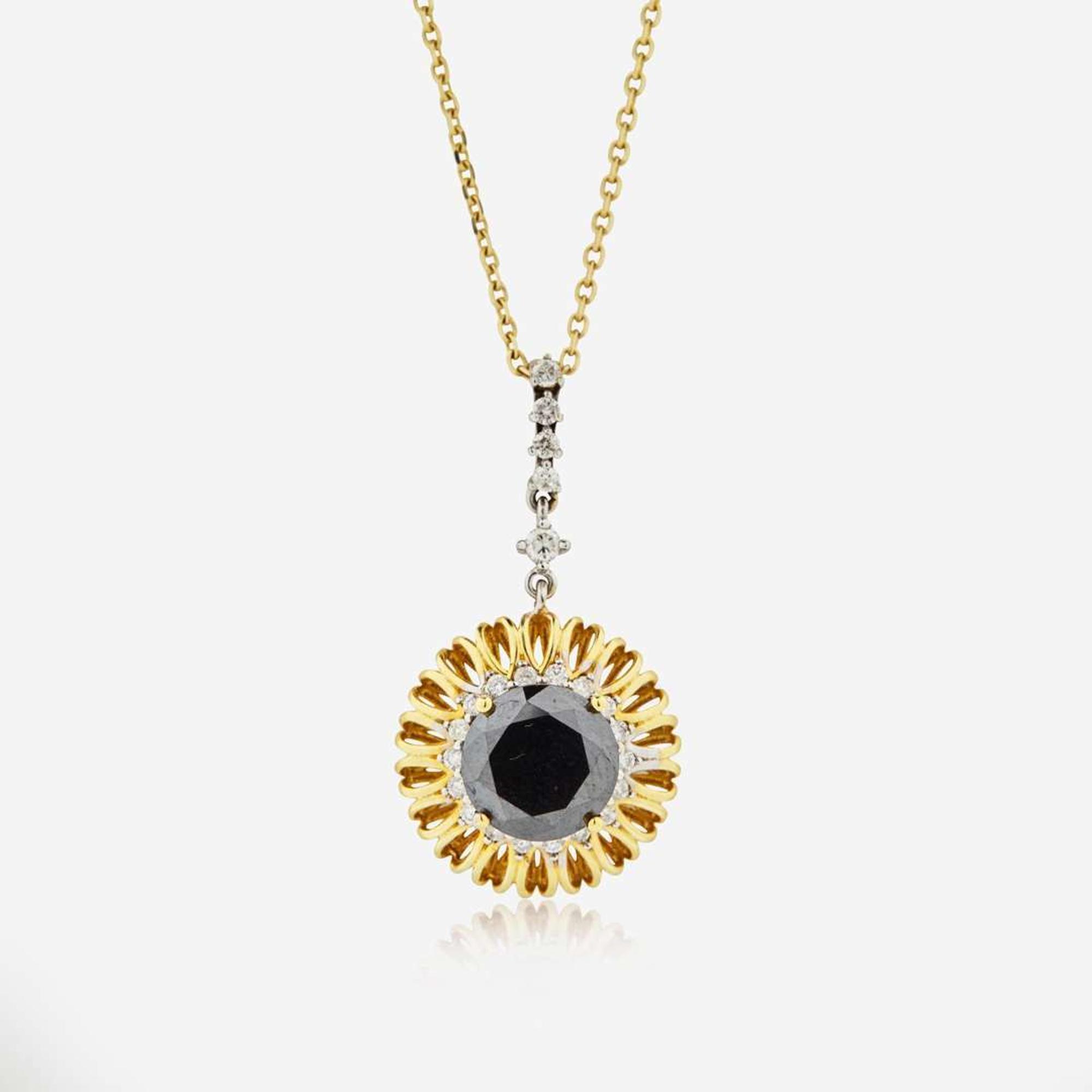 An 18K Yellow Gold Black Diamond and Diamond Pendant on a 14K Chain