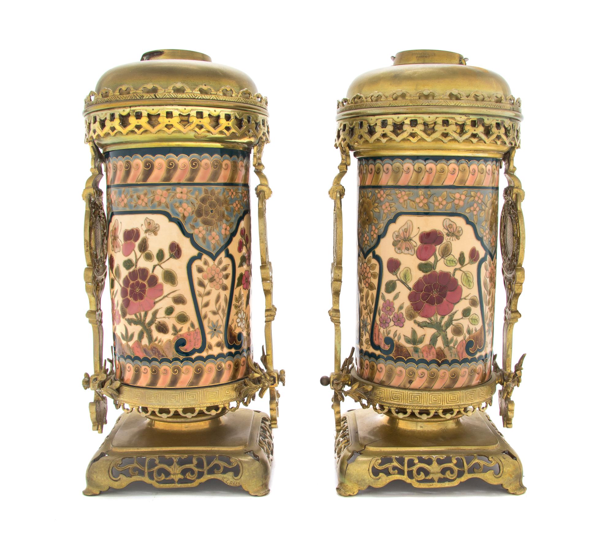 A Pair of Zsolnay Gilt Bronze and Brass Mounted Fluid Lamp Bases, Height 14 1/4 inches.