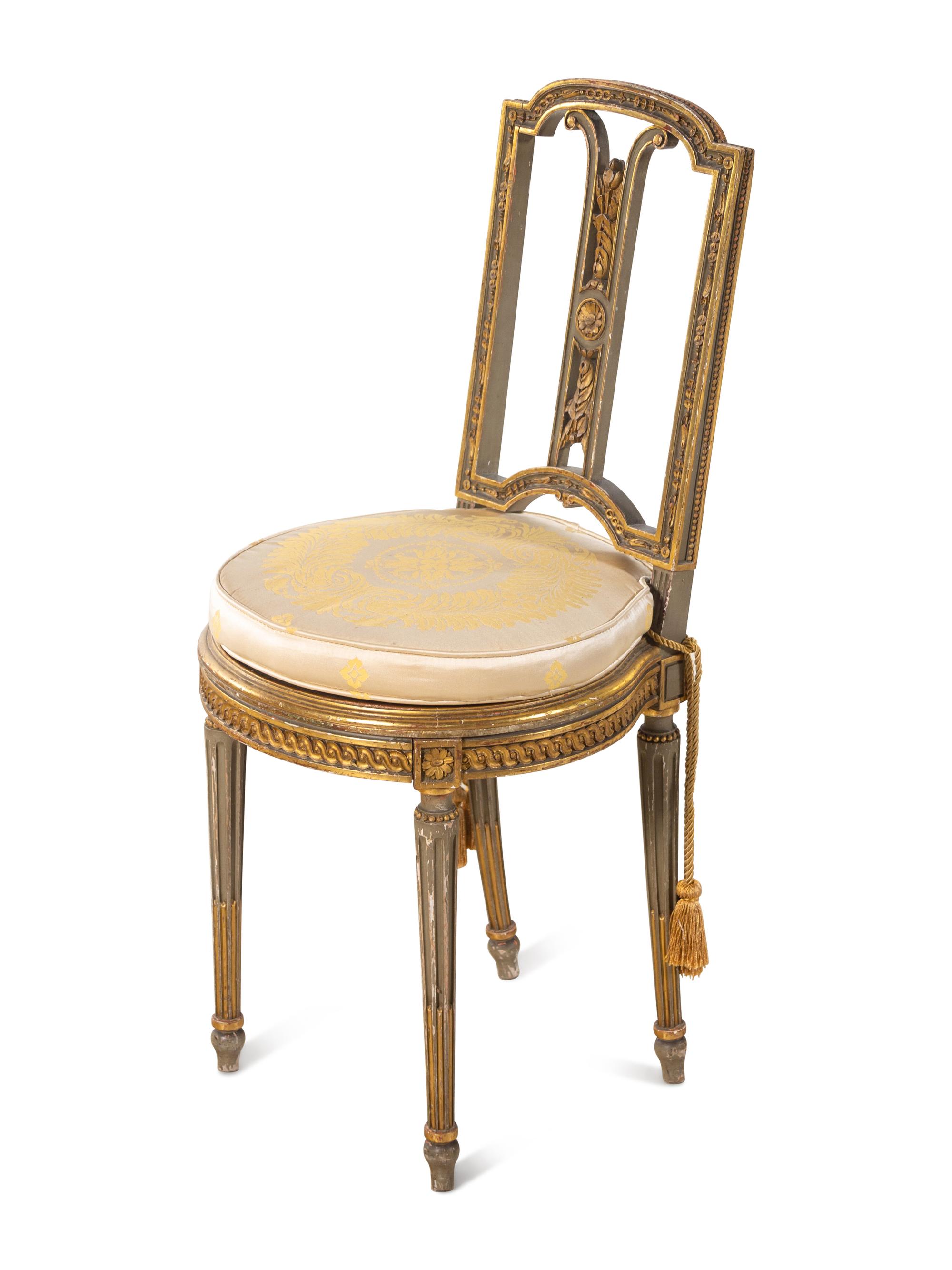A Pair of Louis XVI Style Painted and Parcel Gilt Side Chairs