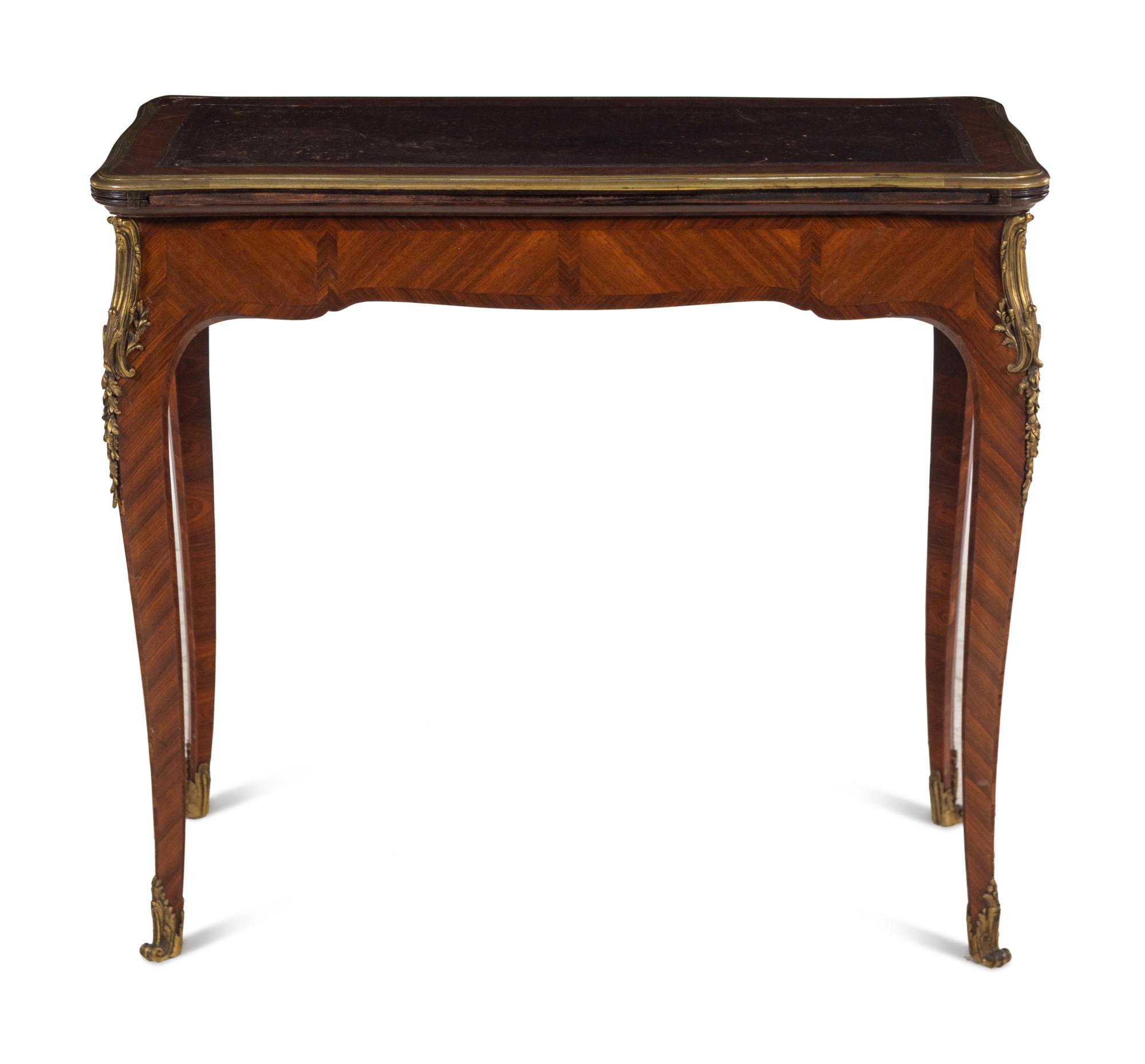 A Louis XV Style Gilt Bronze Mounted Tulipwood Flip-Top Writing Table