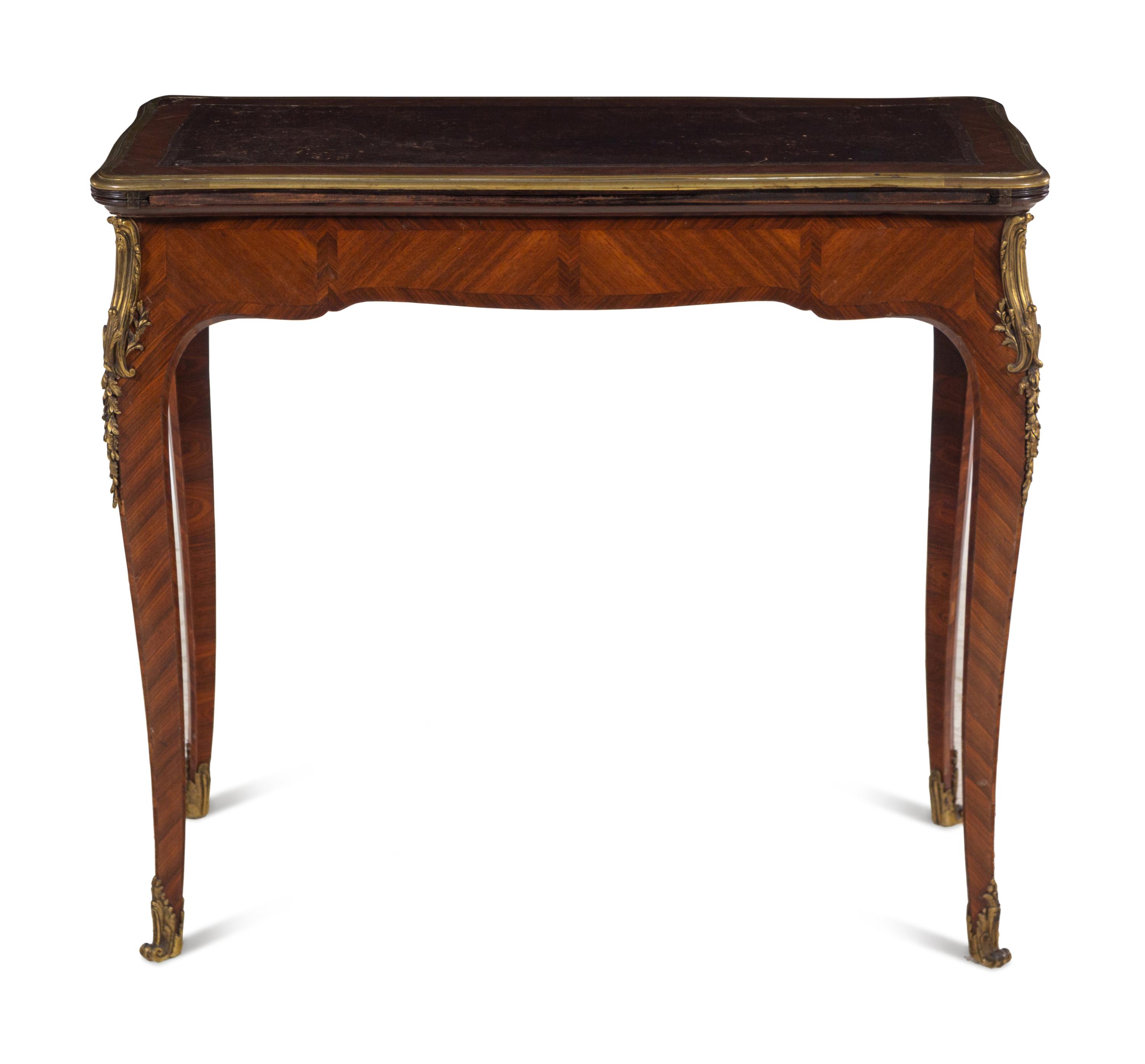 A Louis XV Style Gilt Bronze Mounted Tulipwood Flip-Top Writing Table