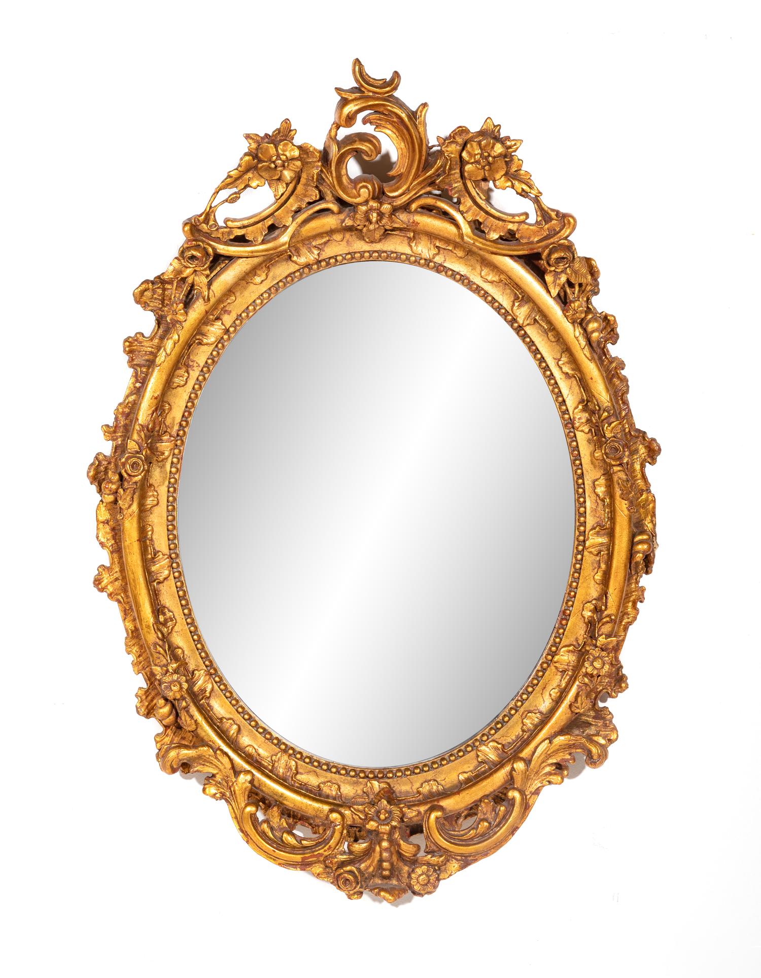 A Rococo Style Giltwood Mirror