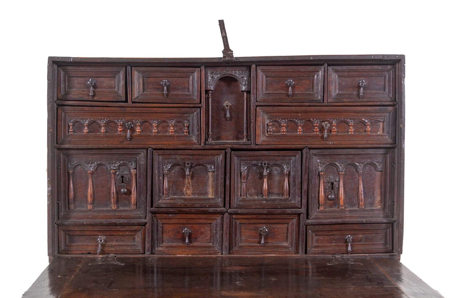 A Spanish Iron Mounted Carved Walnut Vargueño on Stand