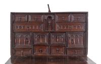 A Spanish Iron Mounted Carved Walnut Vargueño on Stand