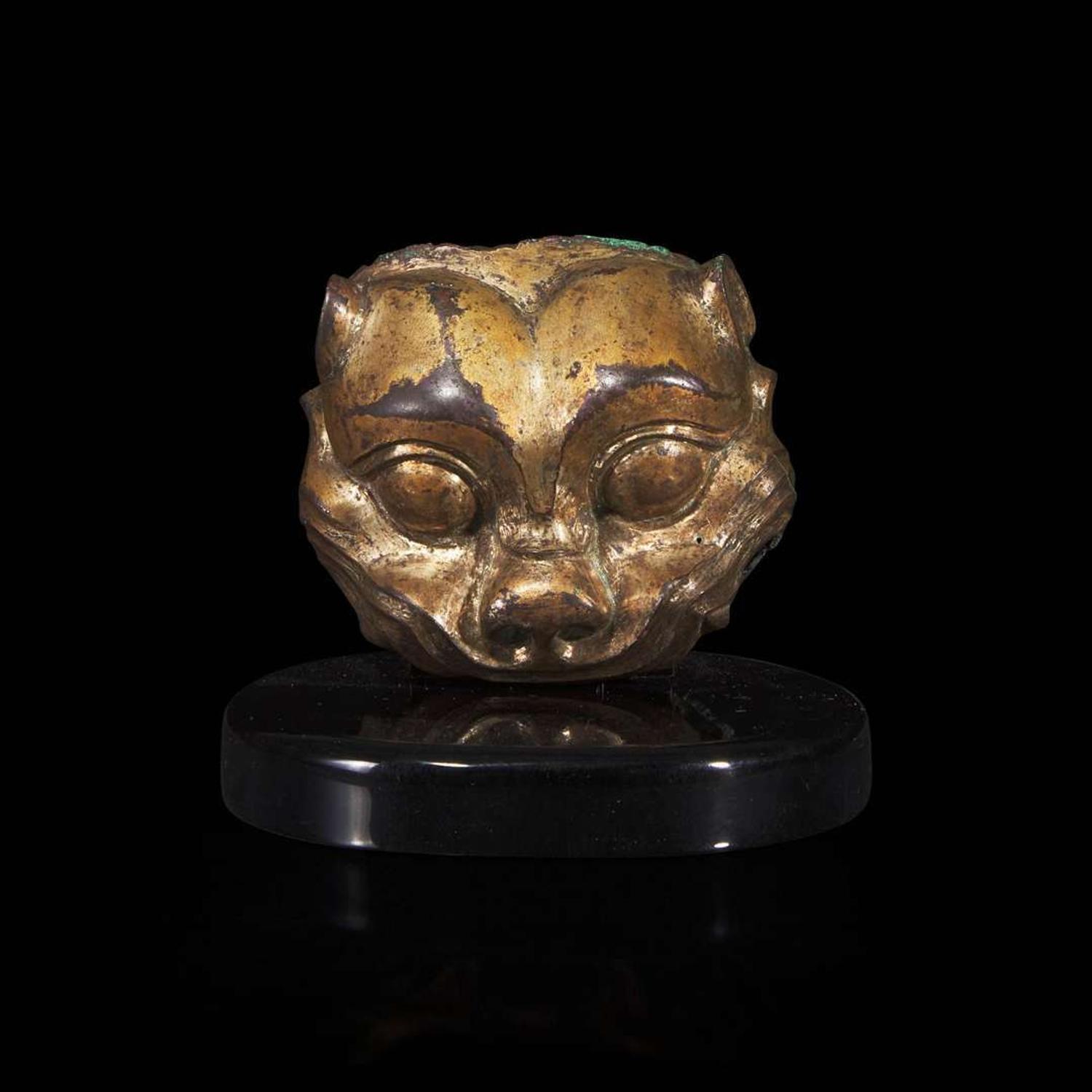A Chinese gilded bronze feline head fitting 铜鎏金兽首 Warring States/Han dynasty ????