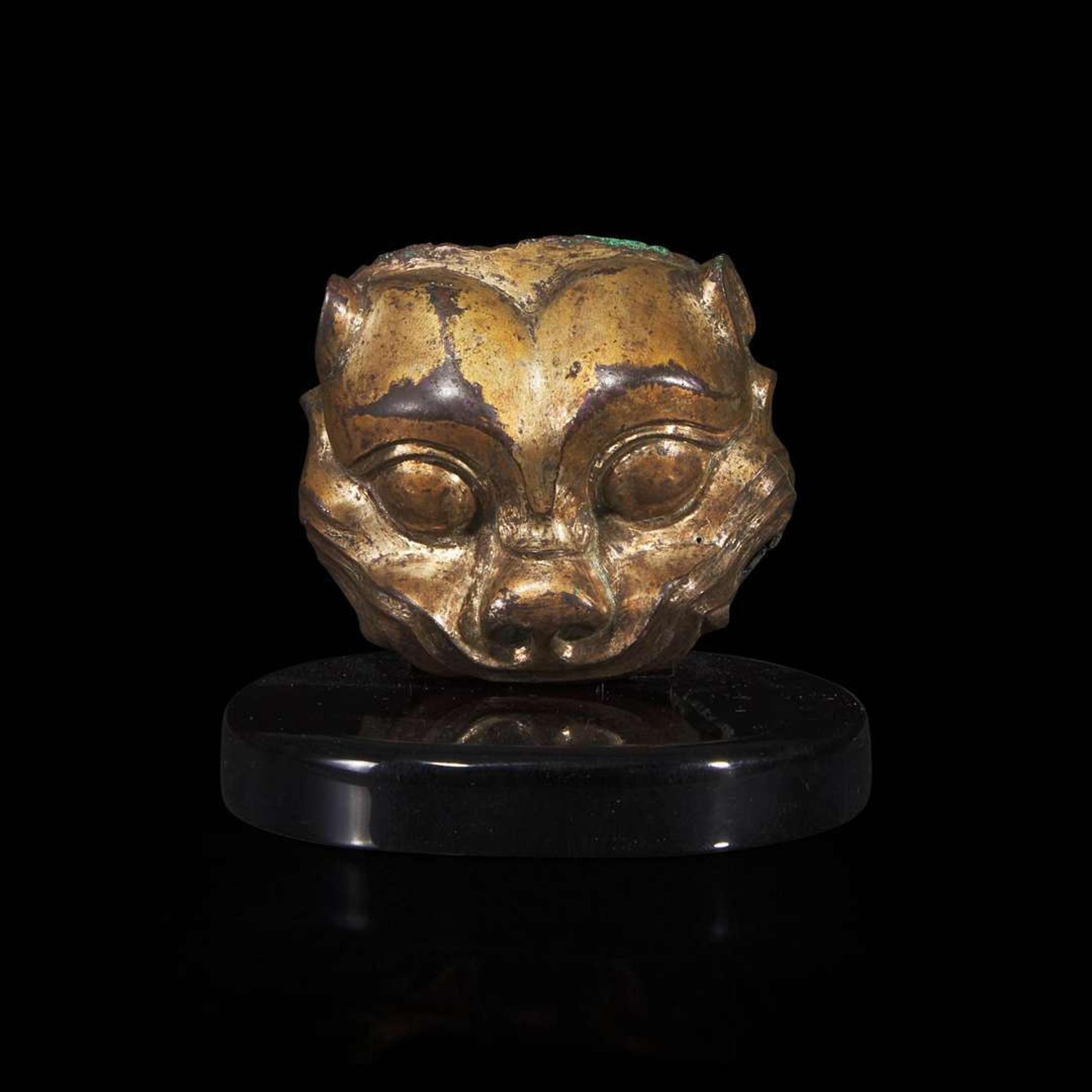 A Chinese gilded bronze feline head fitting 铜鎏金兽首 Warring States/Han dynasty ????