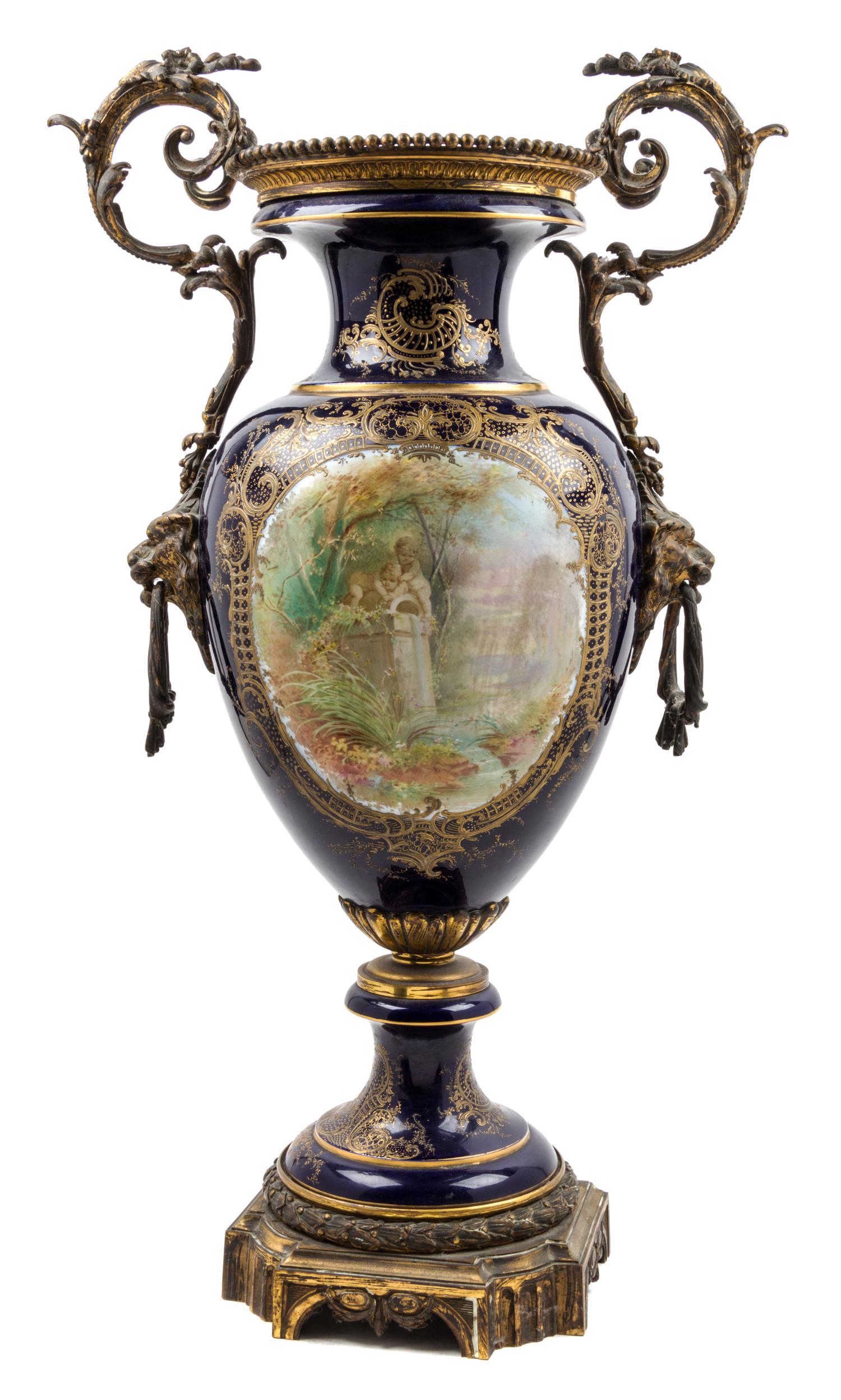 A Sevres Style Gilt Bronze Mounted Porcelain Urn Height 32 inches.