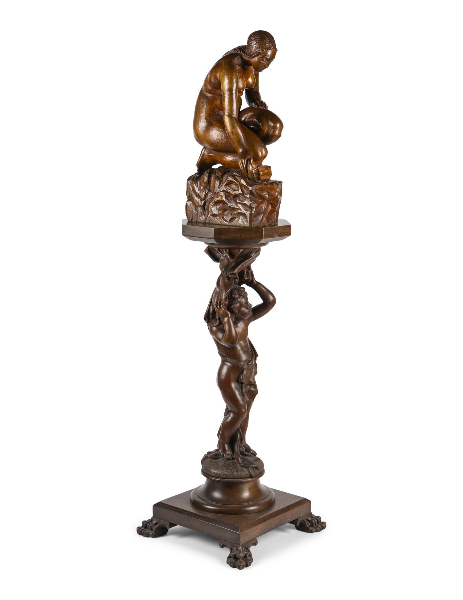 A Carved Wood Sculpture and a Venetian Style Carved Walnut Pedestal