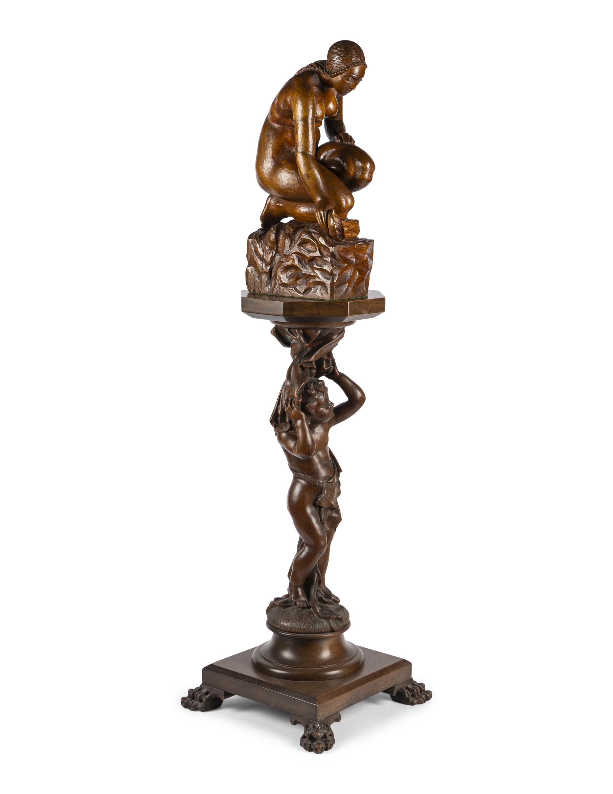 A Carved Wood Sculpture and a Venetian Style Carved Walnut Pedestal
