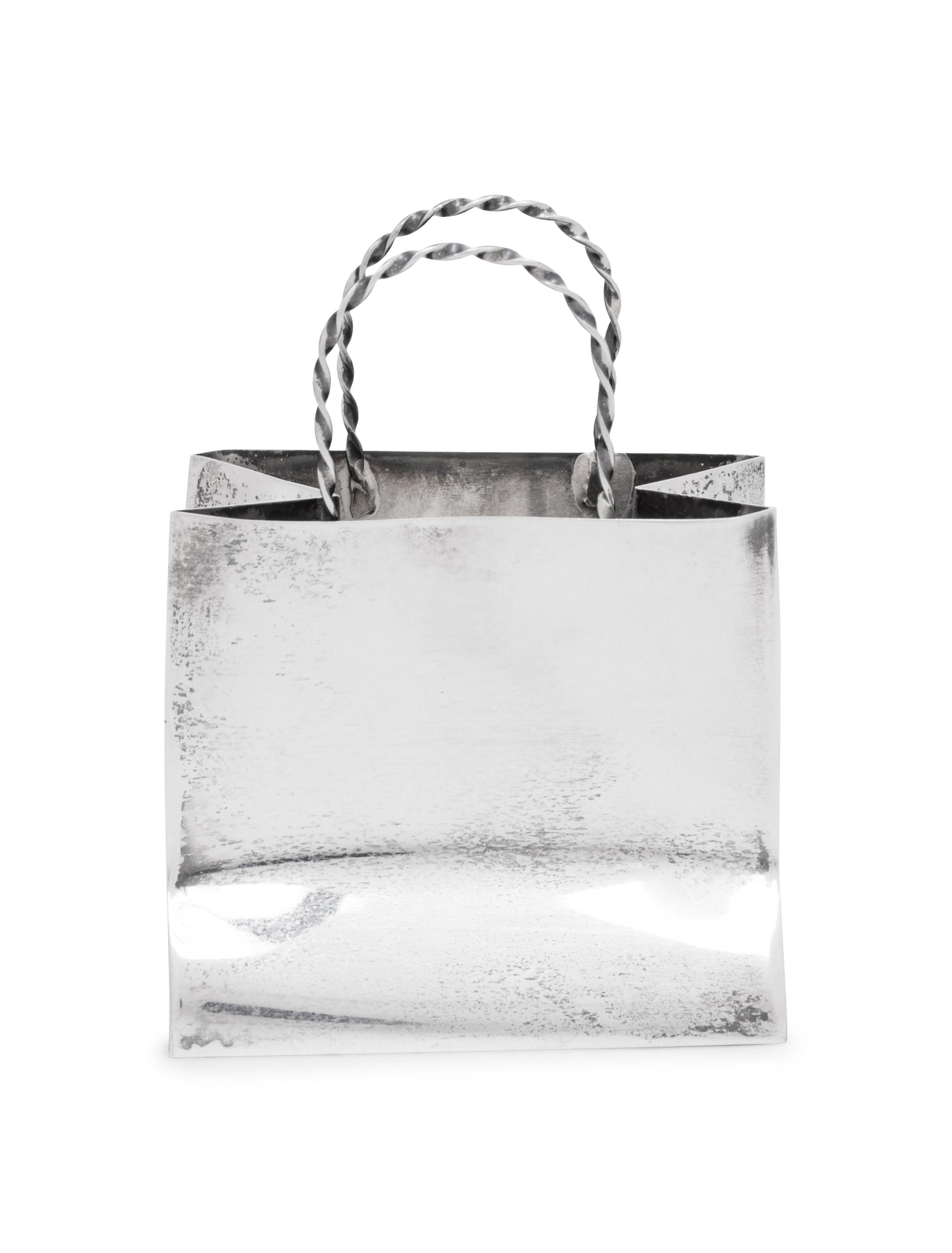 A Cartier Silver Table Article