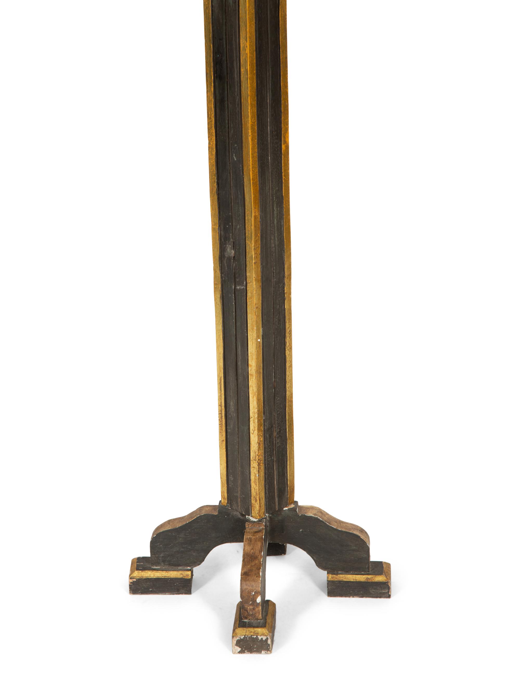 A Pair of Neoclassical Style Black and Gilt Torcheres