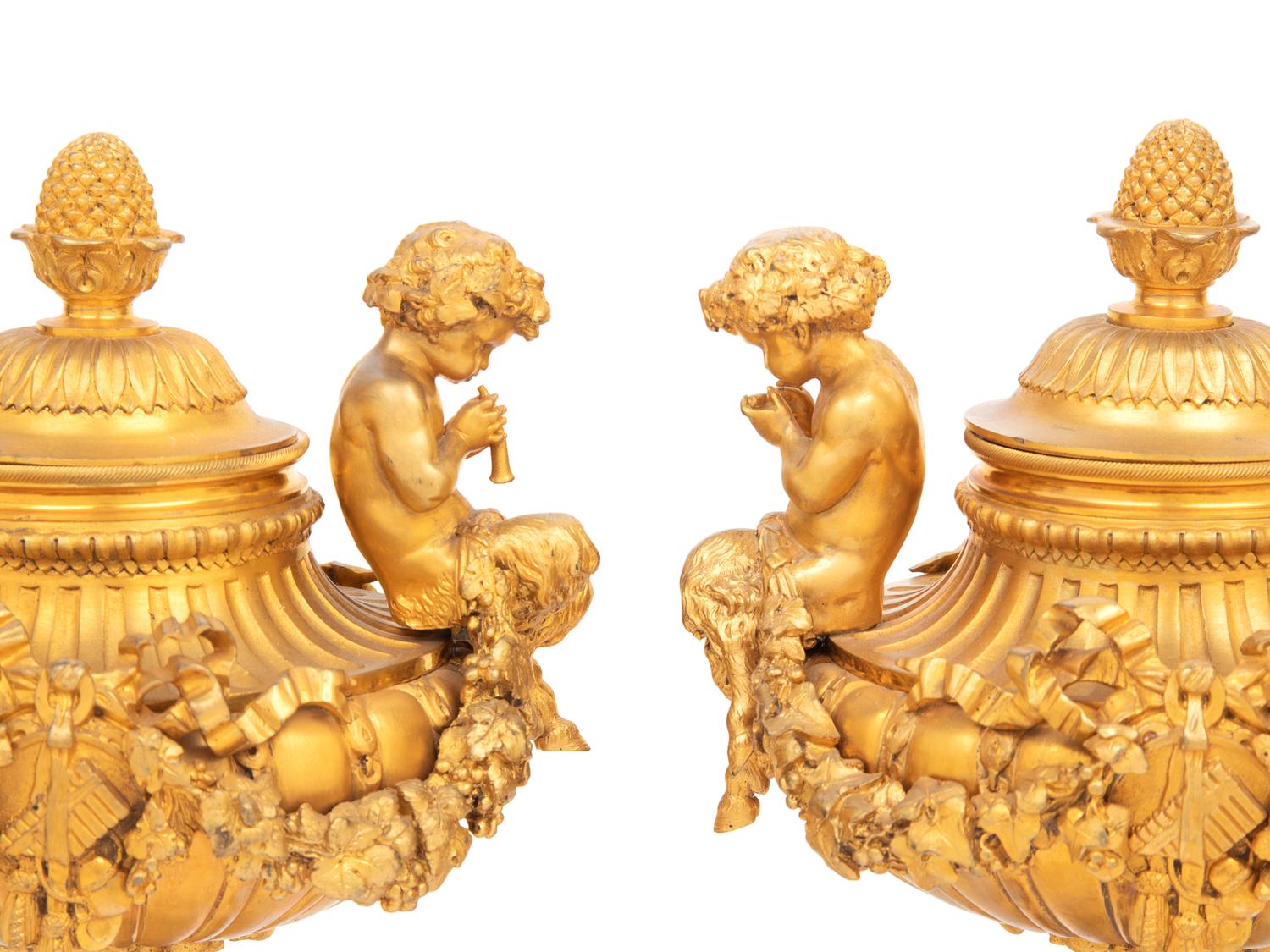 A Pair of Louis XVI Style Gilt Bronze and Marble Covered Urns