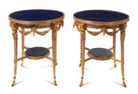 A Pair of Louis XVI Style Lapis Lazuli Veneered and Gilt Bronze Mounted Gueridons, Height 31 x diameter 27 1/2 inches.