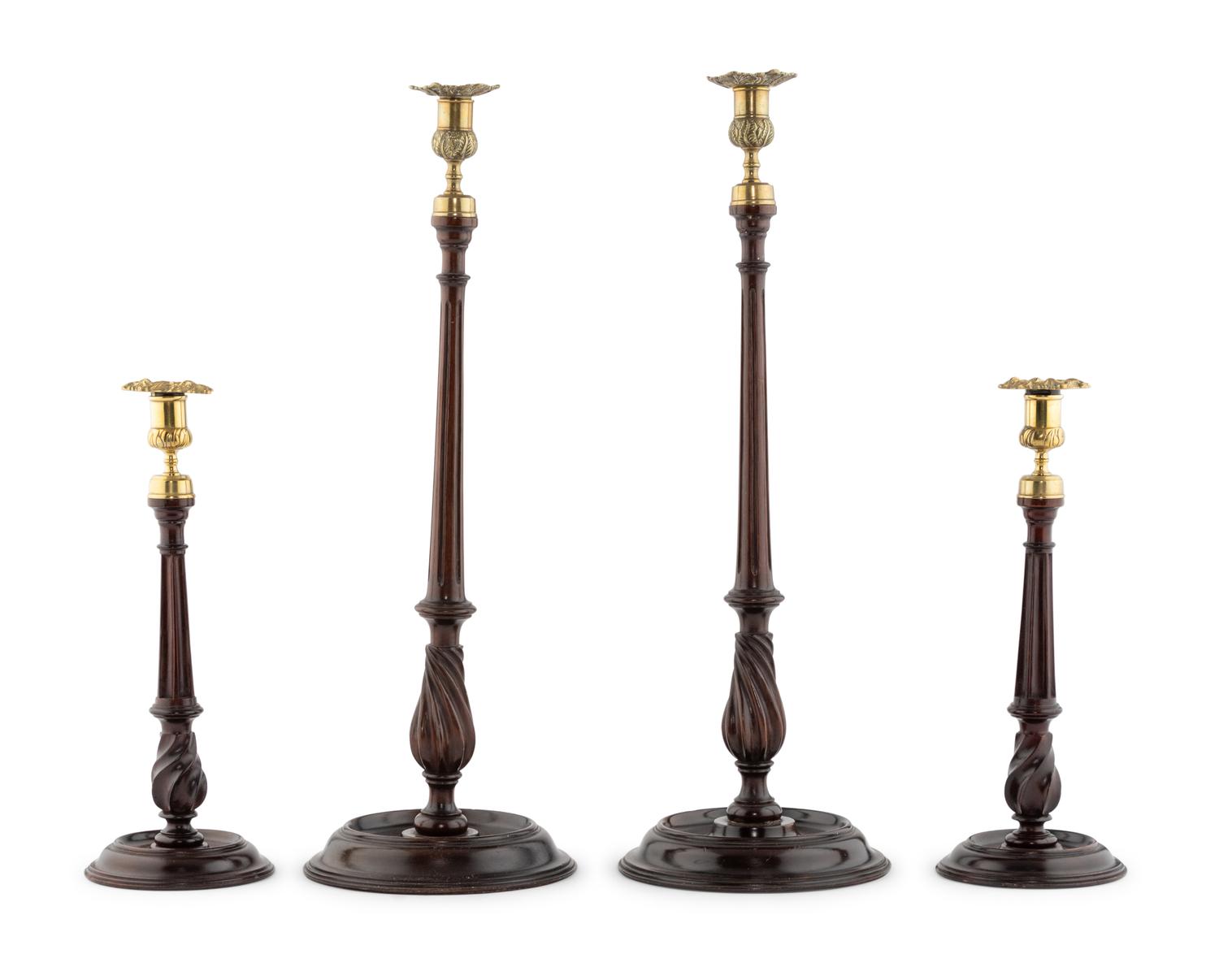 A Group of Four English Mahogany and Brass Mounted Candlesticks