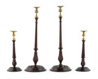 A Group of Four English Mahogany and Brass Mounted Candlesticks