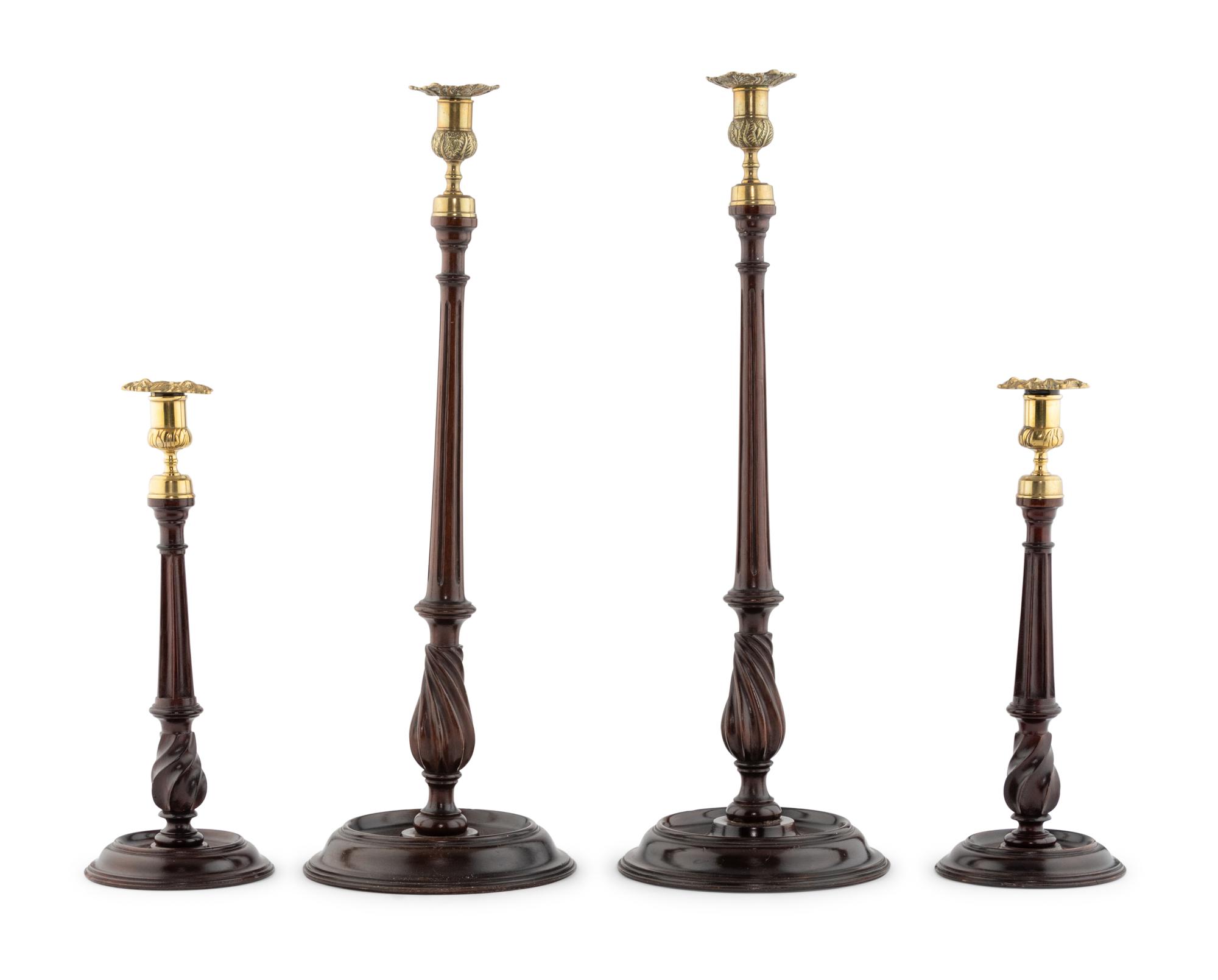 A Group of Four English Mahogany and Brass Mounted Candlesticks