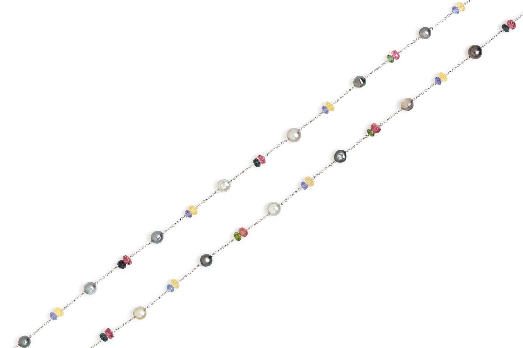 A Platinum, Cultured Pearl and Multigem Longchain Necklace, 14.20 dwts.