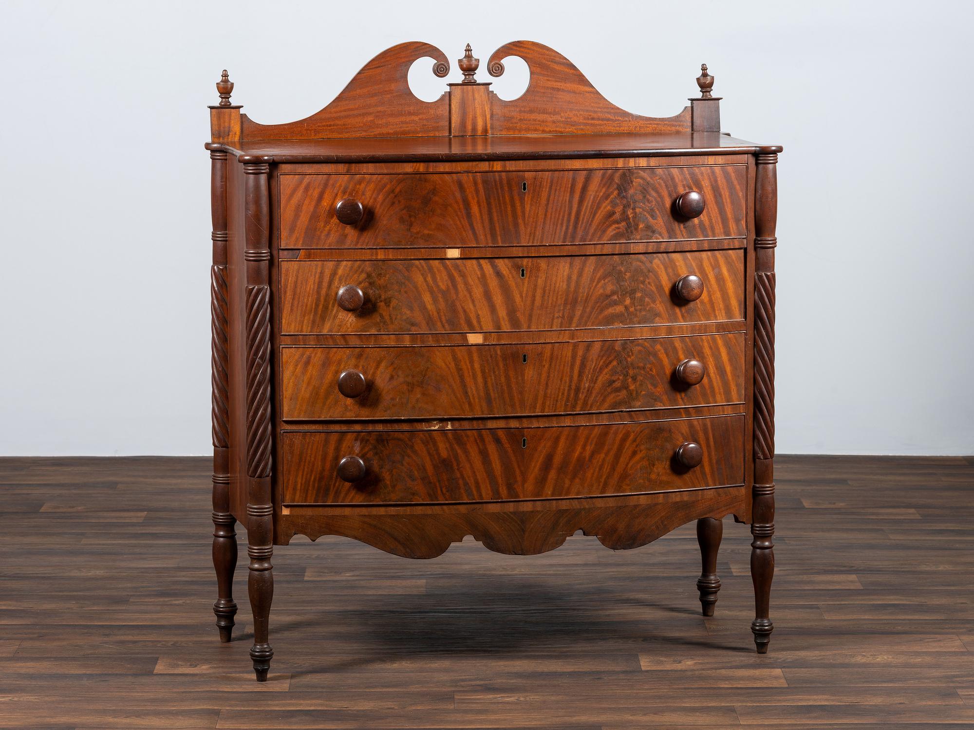A Late Federal Spiral-Twist Carved and Figured Mahogany Chest of Drawers