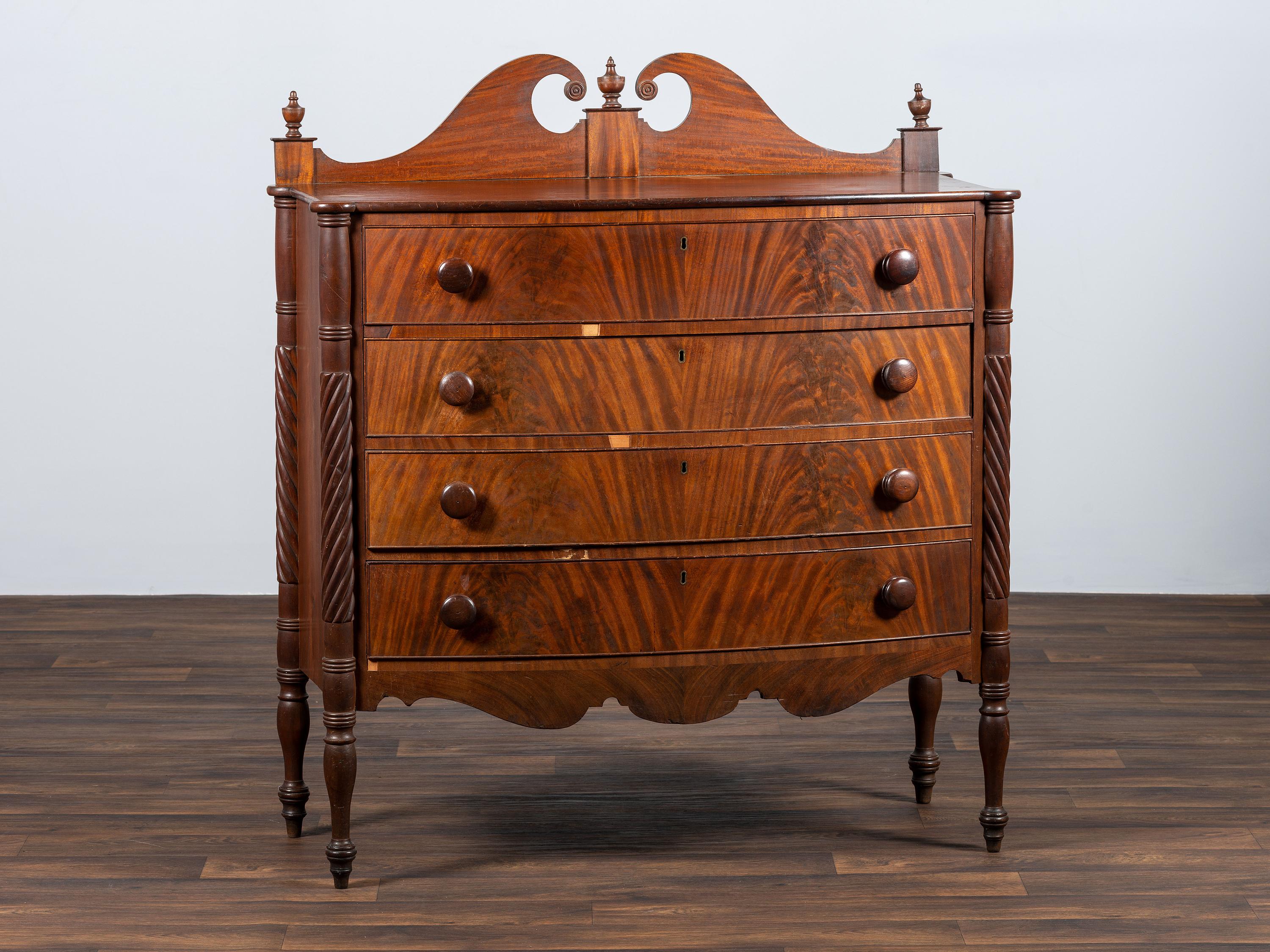 A Late Federal Spiral-Twist Carved and Figured Mahogany Chest of Drawers